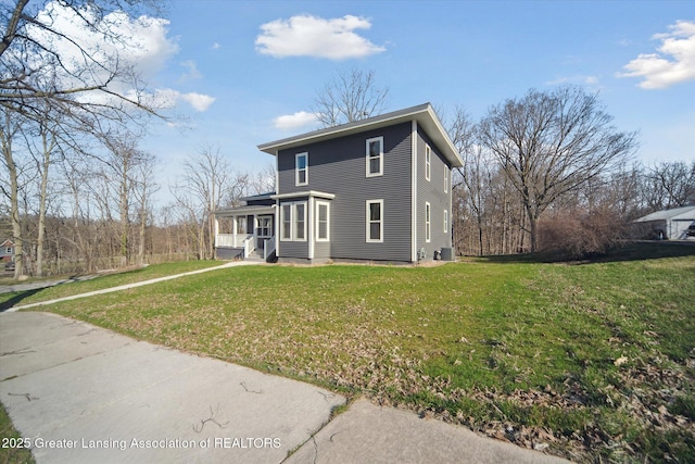 view of front of property featuring central AC unit and a front lawn