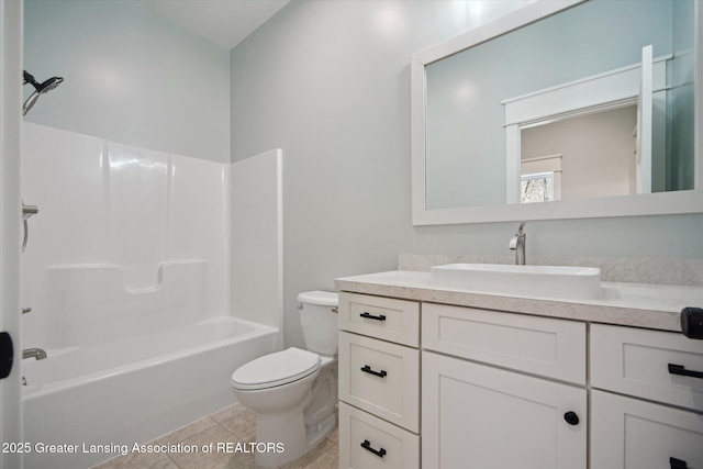 bathroom with tile patterned floors, vanity, toilet, and shower / washtub combination