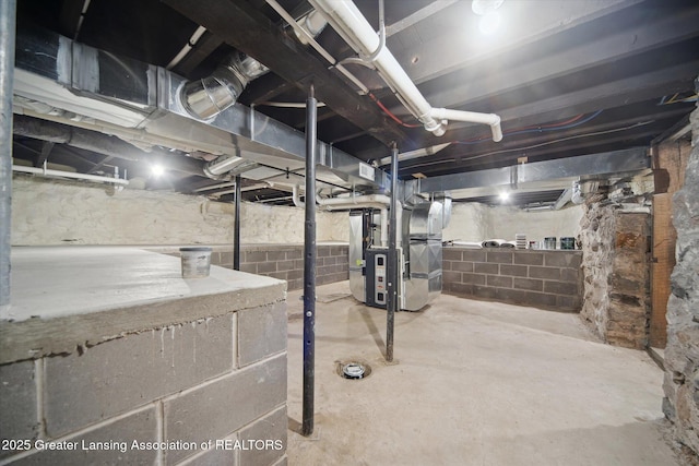 unfinished basement featuring heating unit