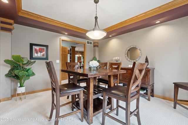 5810 Caleta Dr, Lansing, MI 48911 - dining space with light colored carpet, a raised ceiling, baseboards, ornamental molding, and recessed lighting