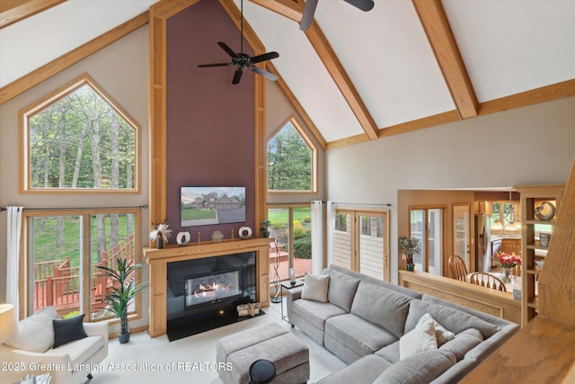 5810 Caleta Dr, Lansing, MI 48911 - living area with high vaulted ceiling, a ceiling fan, beamed ceiling, a fireplace with flush hearth, and carpet flooring