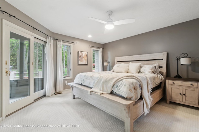 5810 Caleta Dr, Lansing, MI 48911 - bedroom with light carpet, access to exterior, a ceiling fan, and recessed lighting