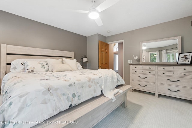 5810 Caleta Dr, Lansing, MI 48911 - bedroom with light carpet and a ceiling fan