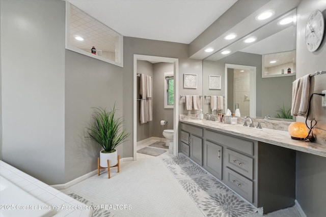 5810 Caleta Dr, Lansing, MI 48911 - full bathroom with recessed lighting, toilet, baseboards, double vanity, and a shower
