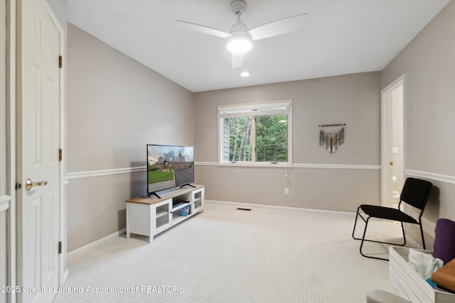 5810 Caleta Dr, Lansing, MI 48911 - living area with carpet flooring, ceiling fan, and baseboards