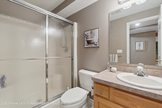 5810 Caleta Dr, Lansing, MI 48911 - bathroom with an enclosed shower, toilet, and vanity
