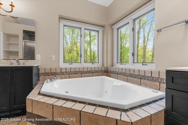 4345 Courtside Dr, Williamston, MI 48895 - full bath with vanity and a jetted tub