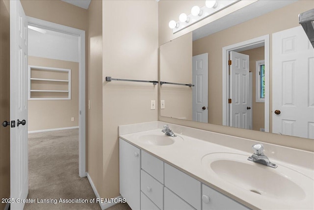 4345 Courtside Dr, Williamston, MI 48895 - full bathroom featuring double vanity and baseboards