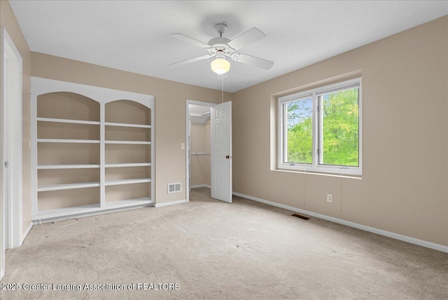 4345 Courtside Dr, Williamston, MI 48895 - unfurnished bedroom featuring carpet, baseboards, and a ceiling fan