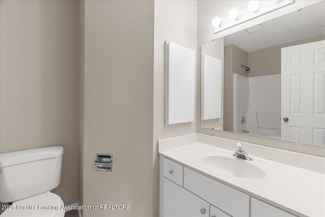 4345 Courtside Dr, Williamston, MI 48895 - bathroom with toilet, vanity, and a shower