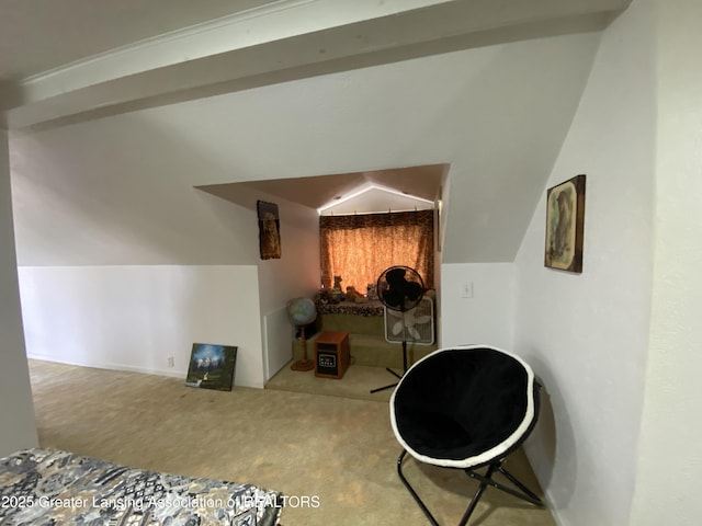hallway with carpet flooring and vaulted ceiling