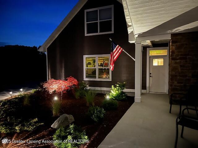 view of exterior entry at night
