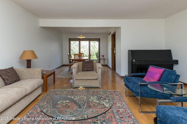 1210 Whittier Dr, East Lansing, MI 48823 - living area featuring baseboards and wood finished floors
