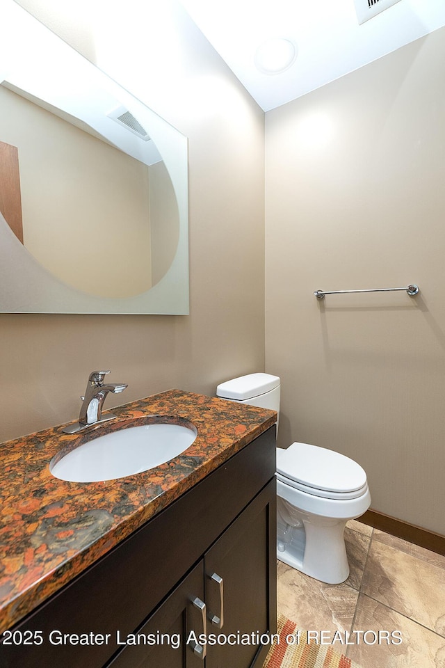 1210 Whittier Dr, East Lansing, MI 48823 - bathroom with toilet and vanity
