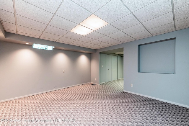 1210 Whittier Dr, East Lansing, MI 48823 - finished below grade area featuring carpet flooring, baseboards, and a paneled ceiling