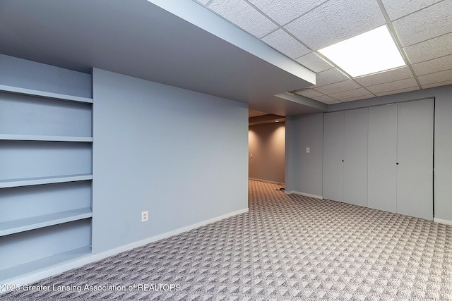1210 Whittier Dr, East Lansing, MI 48823 - finished below grade area with carpet floors, baseboards, and built in shelves