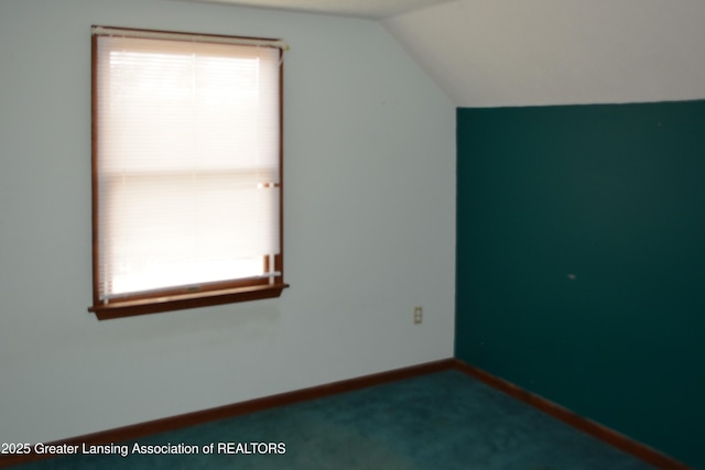 bonus room with baseboards, carpet, and lofted ceiling