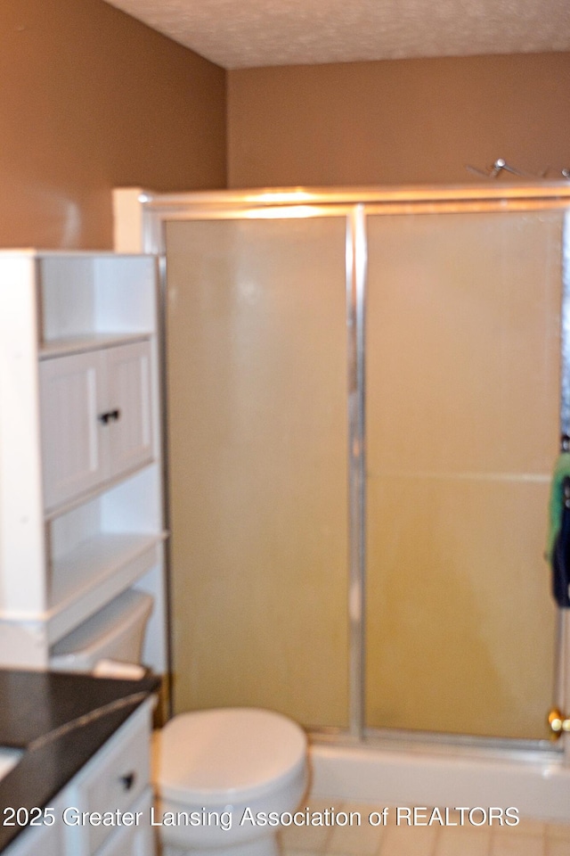 full bathroom with toilet and a shower with door