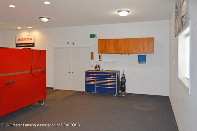 misc room with baseboards and recessed lighting