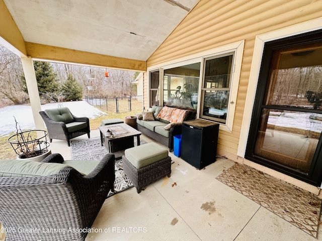 view of patio featuring an outdoor hangout area and fence