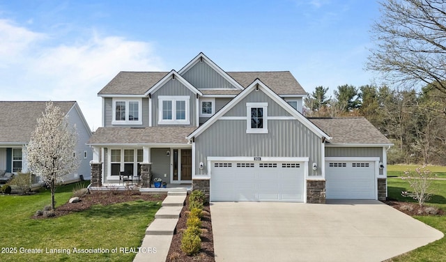 craftsman-style house with concrete driveway, a front yard, board and batten siding, and covered porch