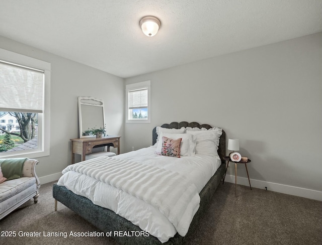 carpeted bedroom featuring baseboards