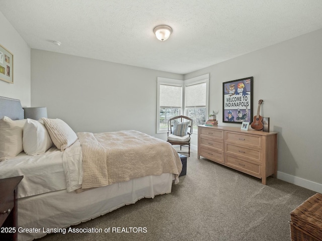 bedroom featuring a textured ceiling, baseboards, and light carpet