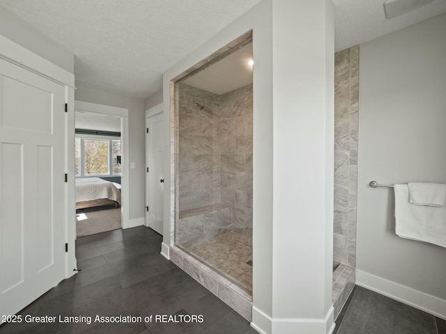 ensuite bathroom with walk in shower, visible vents, baseboards, and connected bathroom