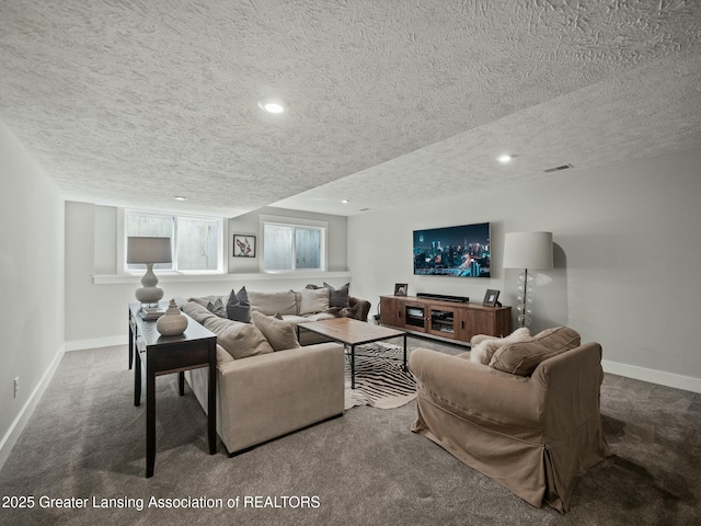 carpeted living area with recessed lighting, a textured ceiling, baseboards, and visible vents