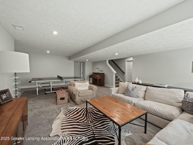 living room with baseboards, carpet flooring, a textured ceiling, and stairway