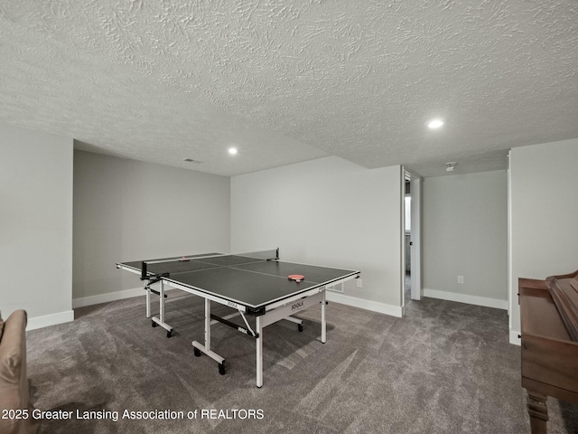 recreation room featuring carpet floors, a textured ceiling, and recessed lighting