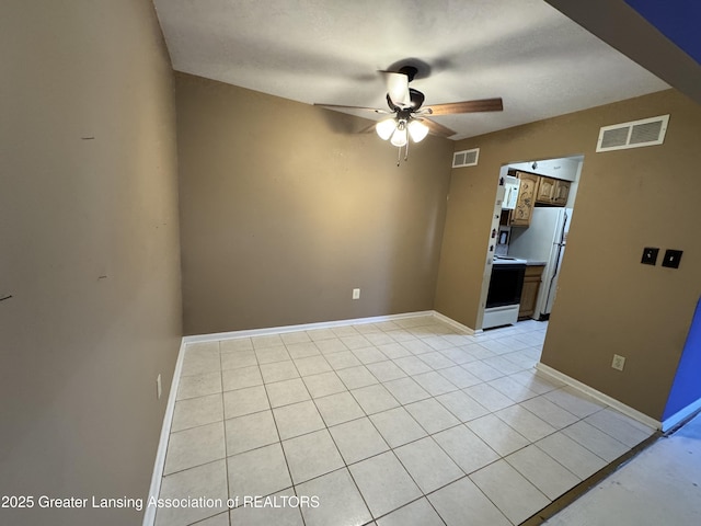 28306 Greenbriar Way, Brownstown, MI 48183 - empty room with baseboards, a ceiling fan, light tile patterned flooring, and visible vents