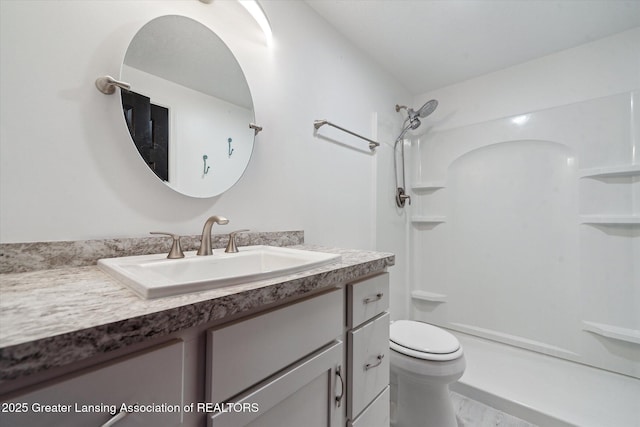full bathroom featuring marble finish floor, toilet, vanity, and a shower