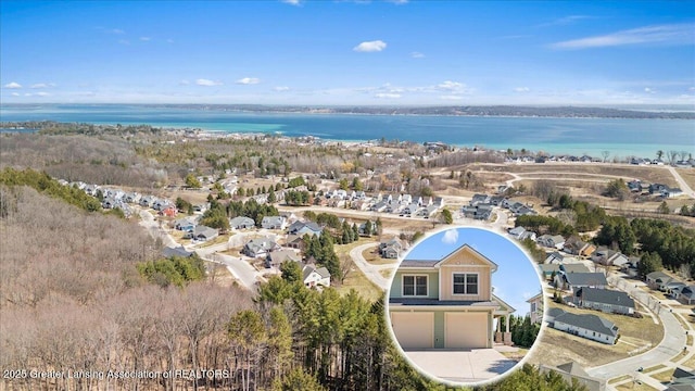 drone / aerial view featuring a water view