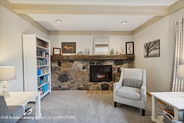 sitting room featuring carpet flooring and a fireplace