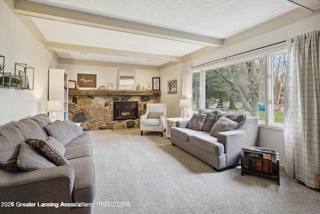 living area featuring beam ceiling and carpet