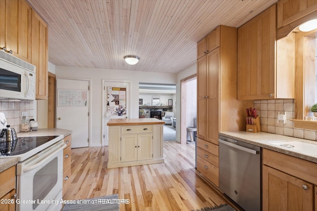 kitchen featuring light wood-style floors, white appliances, wood ceiling, a sink, and backsplash