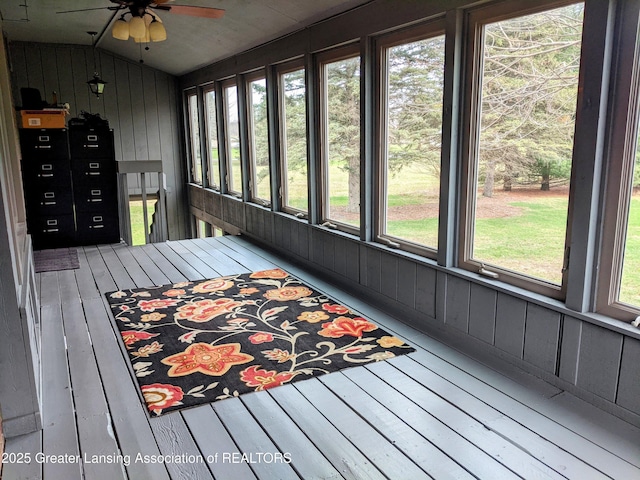 sunroom with a ceiling fan