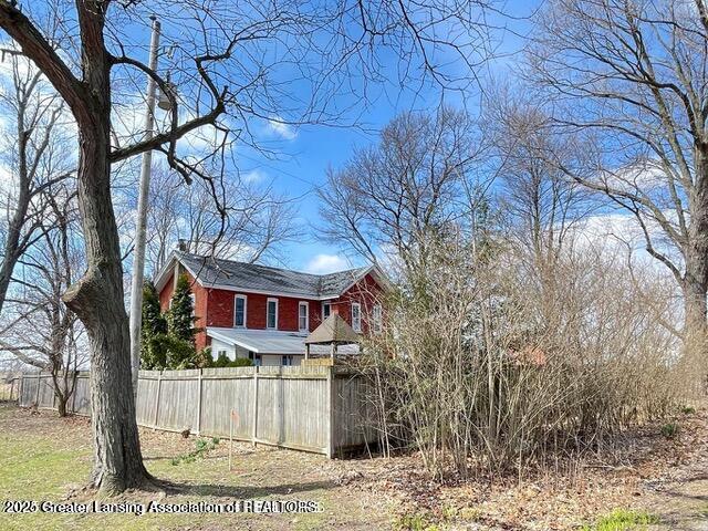 11100 Anderson Rd, Litchfield, MI 49252 - view of home's exterior featuring fence