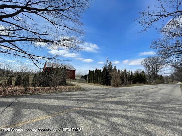 11100 Anderson Rd, Litchfield, MI 49252 - view of asphalt road featuring a barn