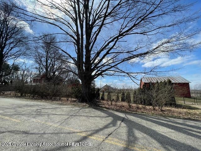 11100 Anderson Rd, Litchfield, MI 49252 - view of asphalt street with a barn