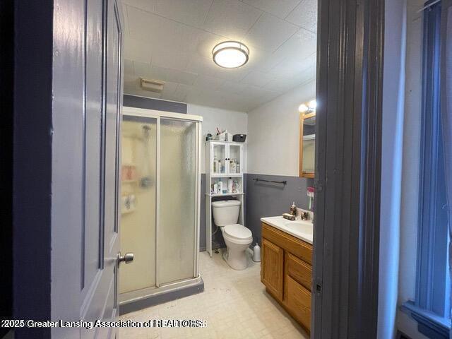 11100 Anderson Rd, Litchfield, MI 49252 - full bath featuring a stall shower, vanity, and toilet