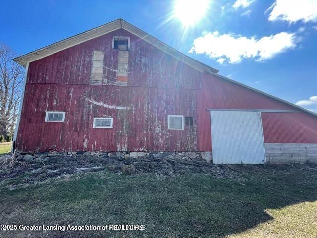 11100 Anderson Rd, Litchfield, MI 49252 - view of home's exterior with an outbuilding, a detached garage, and a barn