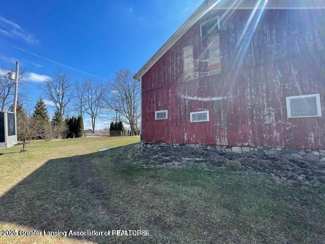 11100 Anderson Rd, Litchfield, MI 49252 - view of home's exterior with a yard