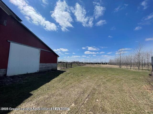 11100 Anderson Rd, Litchfield, MI 49252 - view of yard featuring a view of rural / pastoral area, an outdoor structure, and an outbuilding