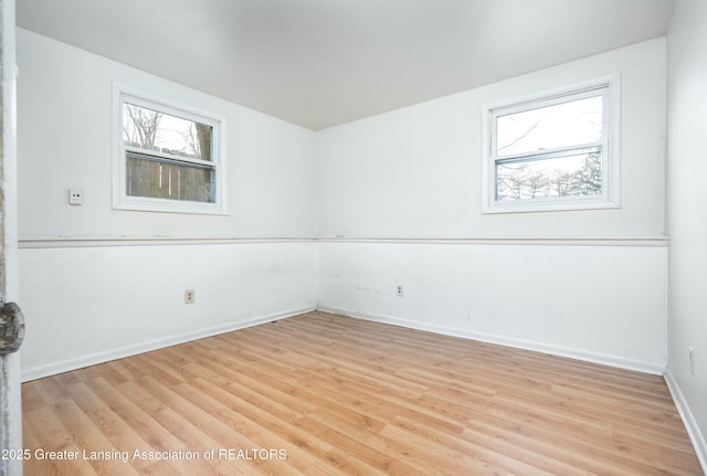 5026 Delray Dr, Lansing, MI 48910 - empty room featuring light wood-style floors and baseboards