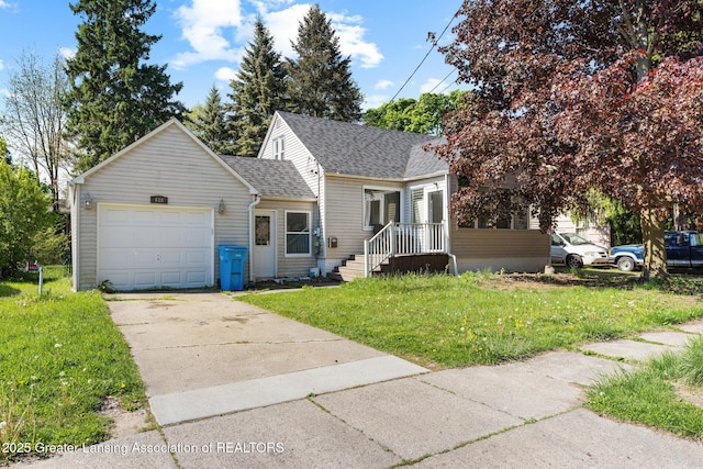 610 Spokane Ave, Lansing, MI 48910 - view of front of property featuring concrete driveway, a front lawn, a garage, roof with shingles, and a chimney