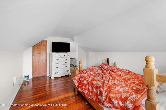 610 Spokane Ave, Lansing, MI 48910 - bedroom with wood-type flooring, vaulted ceiling, and baseboards