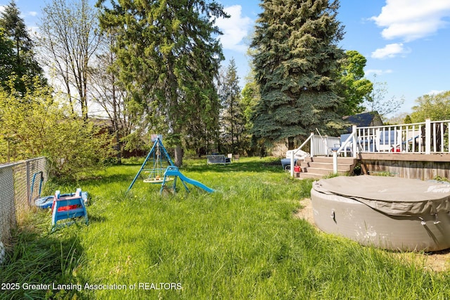 610 Spokane Ave, Lansing, MI 48910 - view of yard with a wooden deck
