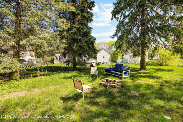 610 Spokane Ave, Lansing, MI 48910 - view of yard featuring an outdoor fire pit